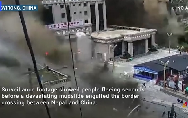 Crushing walls of water overtake buildings on Nepal-Tibet border